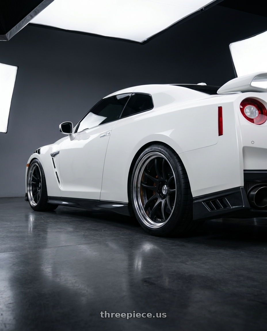 2017 Nissan GTR with Work Cr 2P 5x114.3 20x12.0 +22 Matte Black wheels rear three quarter view square tires