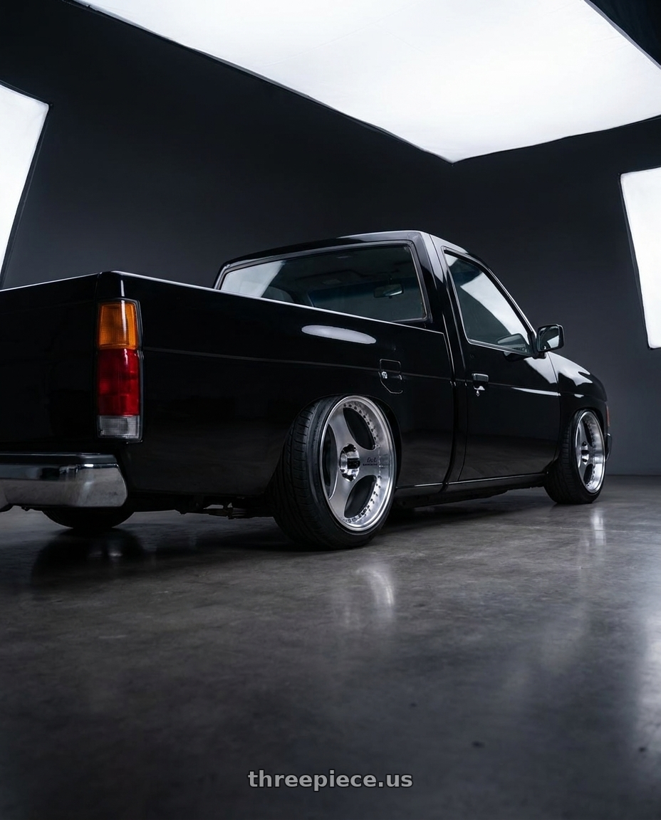 1989 nissan d21 hardbody black  with Advan Racing ONI2 PROGRESSIVE 5x114.3 20x8.5 +33 MACHINING & DIAMOND CUT wheels rear three quarter view slight stretch tires