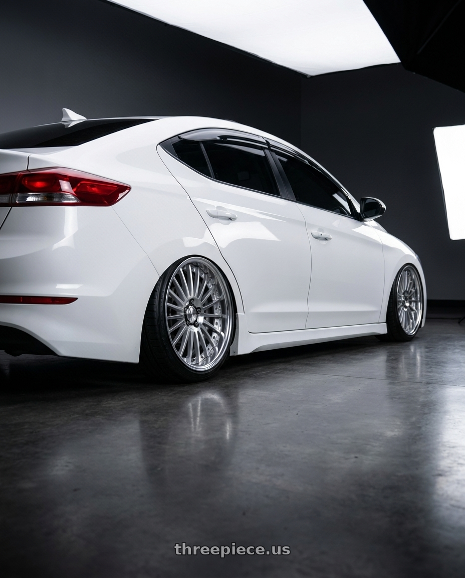 2018 Hyundai Elantra with Work Lanvec Lf1 5x114.3 18x9.5+22 O Disk Machine Silver Polish wheels rear three quarter view slight stretch tires