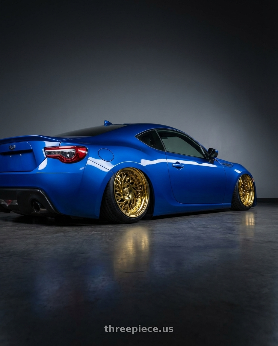 2017 Subaru BRZ with Aodhan DS03 5x100 18x9.5 +35 Gold Vacuum w/ Chrome Rivets wheels rear three quarter view slight stretch tires