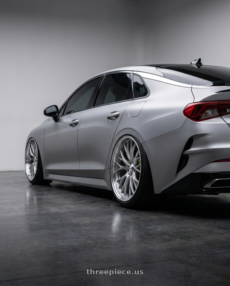 2026 Kia k5 GT with WedsSport SA-20R 5x114.3 19x8.5+45 VI Silver wheels rear three quarter view extreme stretch tires