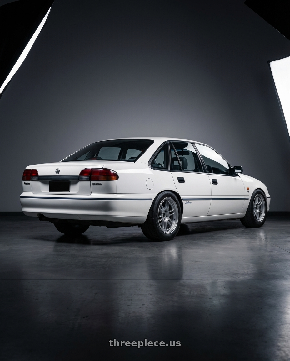 1996 Holden commodore  with Enkei RPF1 5x114.3 17x8+45 Silver wheels rear three quarter view meaty tires