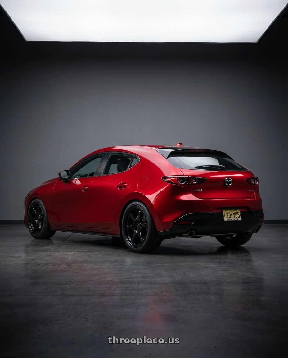 2023 Mazda 3 Premium hatchback with Kansei K14B Roku 5x114.3 18x10.5 12 Gloss Black wheels rear three quarter view square tires