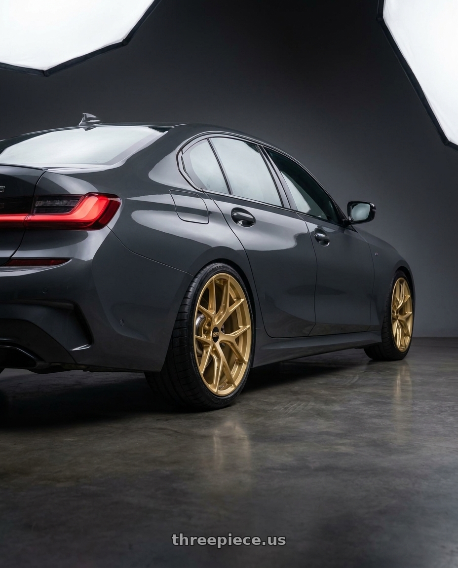 2025 bmw g20 with BBS FI-R 5x120 19x9.5+22 Gold wheels rear three quarter view slight stretch tires
