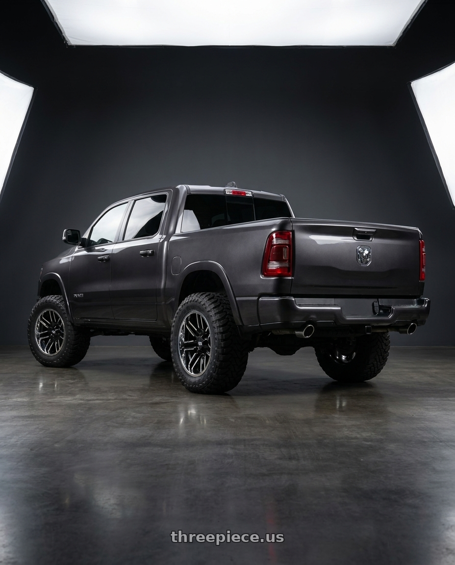 2024 Ram 1500 with Moto Metal MO202 6X139.7 22X12 -44 GLOSS BLACK MACHINED CENTER CHROME LIP wheels rear three quarter view meaty tires