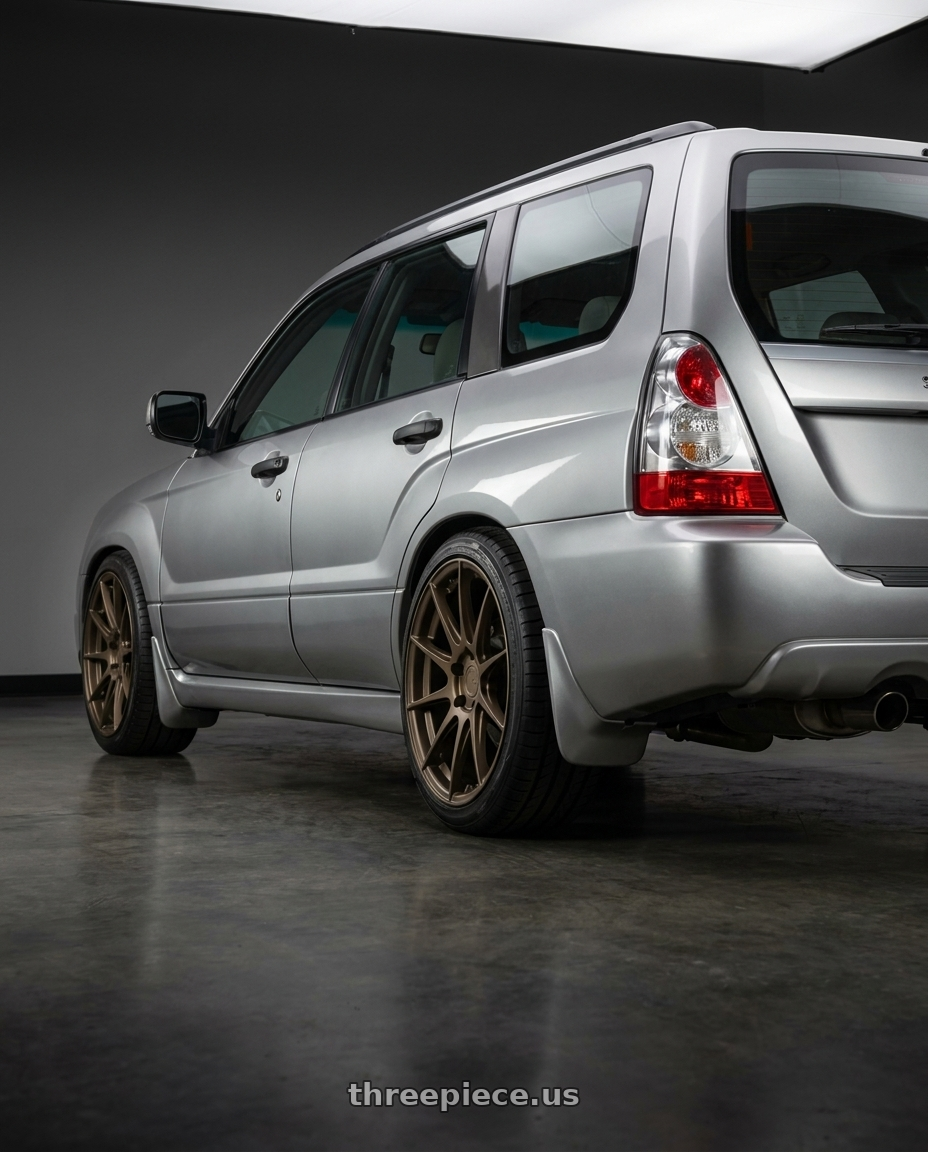 2006 Subaru Fozzy with Aodhan AH09 5x112 18x8.5 +35 Matte Bronze wheels rear three quarter view square tires