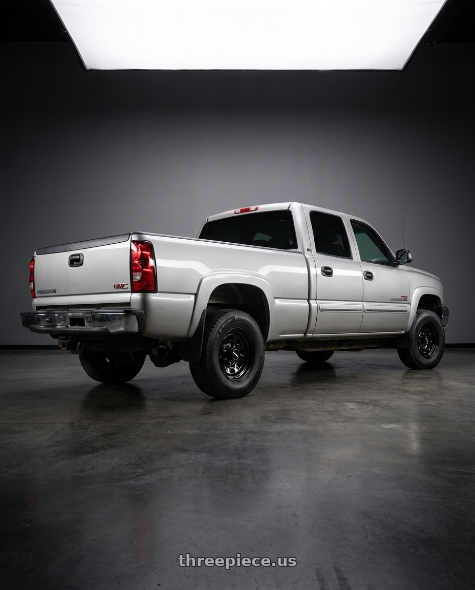 2006 gmc 2500 hd Duramax with Vision HD 84H 8x165.1 16x7+0 Gloss Black wheels rear three quarter view square tires