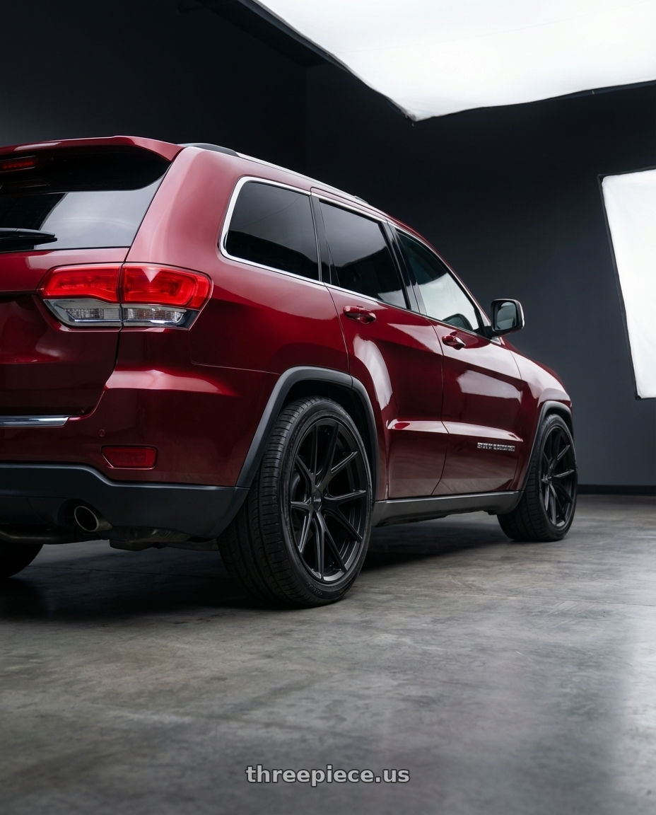 2017 jeep grand cherokee laredo  with Bravado 08B Tribute 5x114.3 19x9.5 +35 Matte Black wheels rear three quarter view slight stretch tires