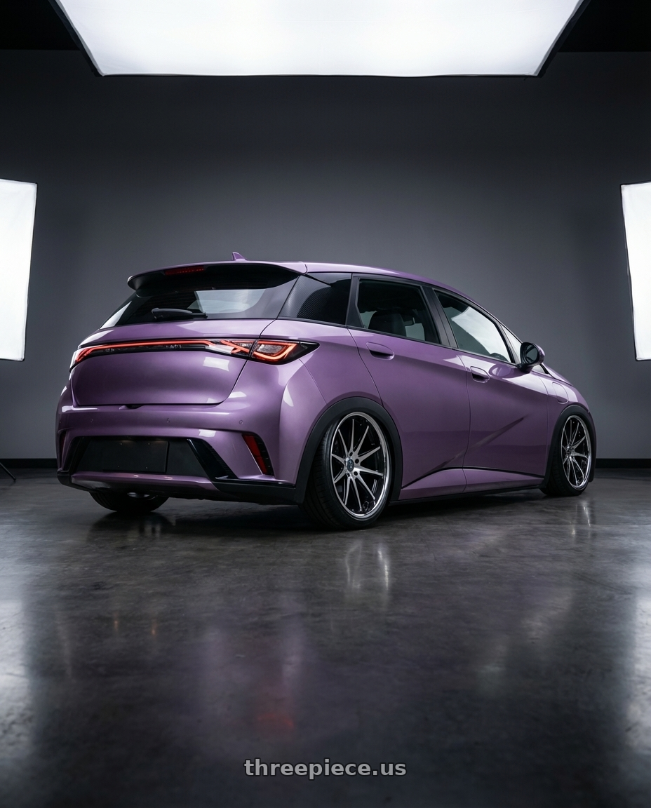 2026 BYD Dolphin with Rohana RFC10 5x114.3 20x9+25 Machine Black/Chrome Lip wheels rear three quarter view slight stretch tires