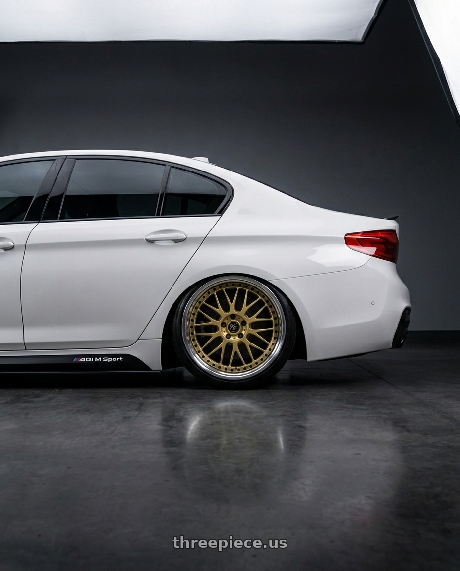 2019 BMW 540i M Sport with Work Vs-Xx 5x112 20x9.5+38 O Disk Gold wheels rear three quarter view slight stretch tires