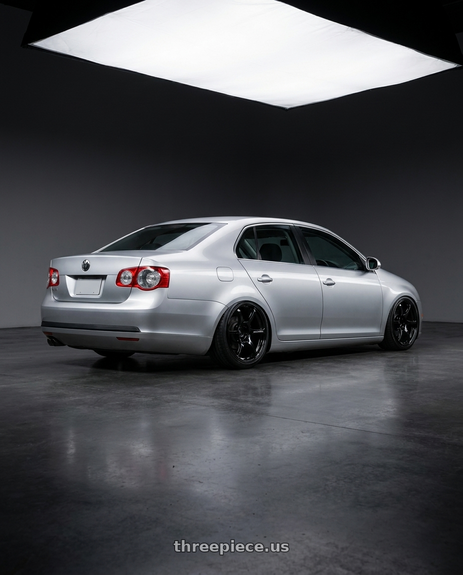 2009 Volkswagen Jetta GLI MK5 with Advan RGIII 5x112 18x8+50 Gloss Black wheels rear three quarter view slight stretch tires