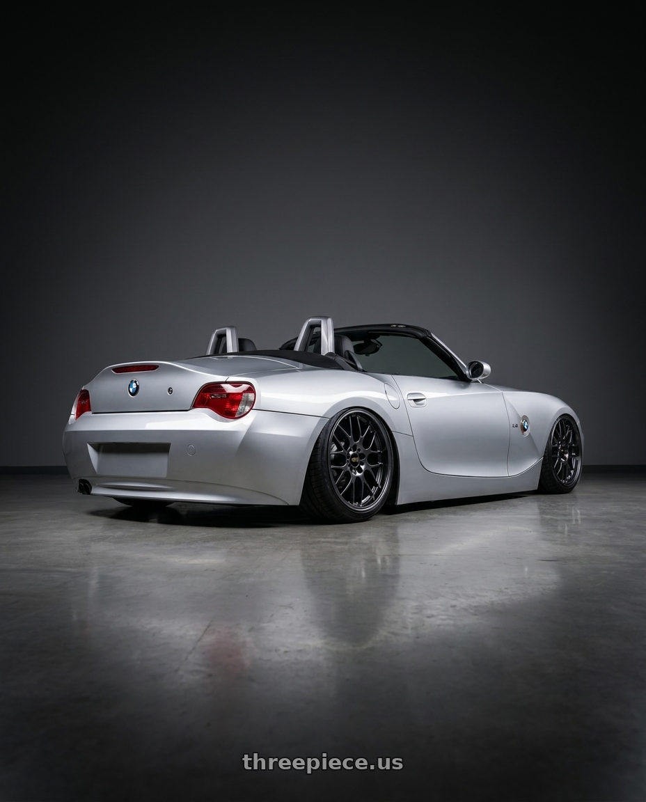 2006 E85 z4 with BBS RG-R 5x120 18x8.5+13 Diamond Black wheels rear three quarter view slight stretch tires