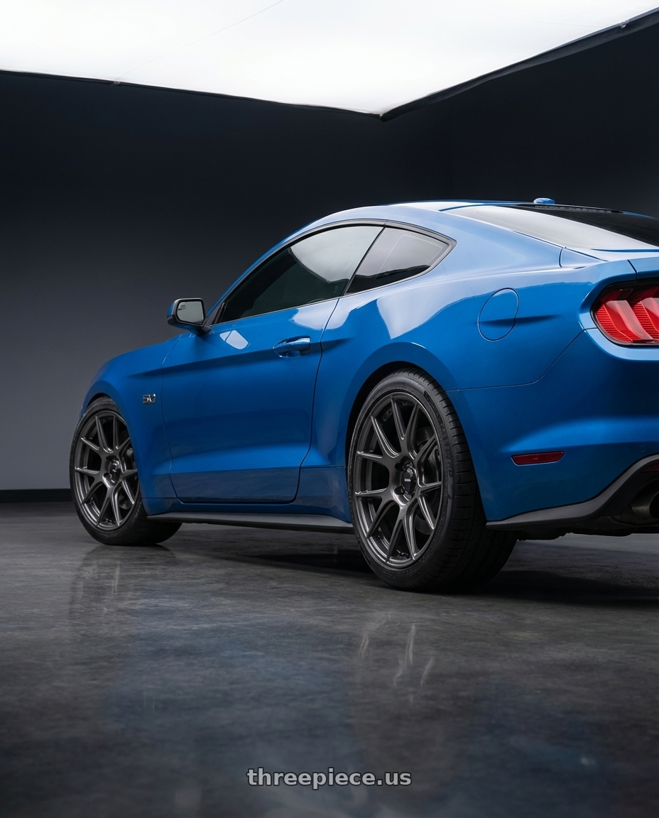 2022 Ford Mustang GT with Konig Ampliform 5x114.3 19x10.5+23 Dark Metallic Graphite wheels rear three quarter view square tires