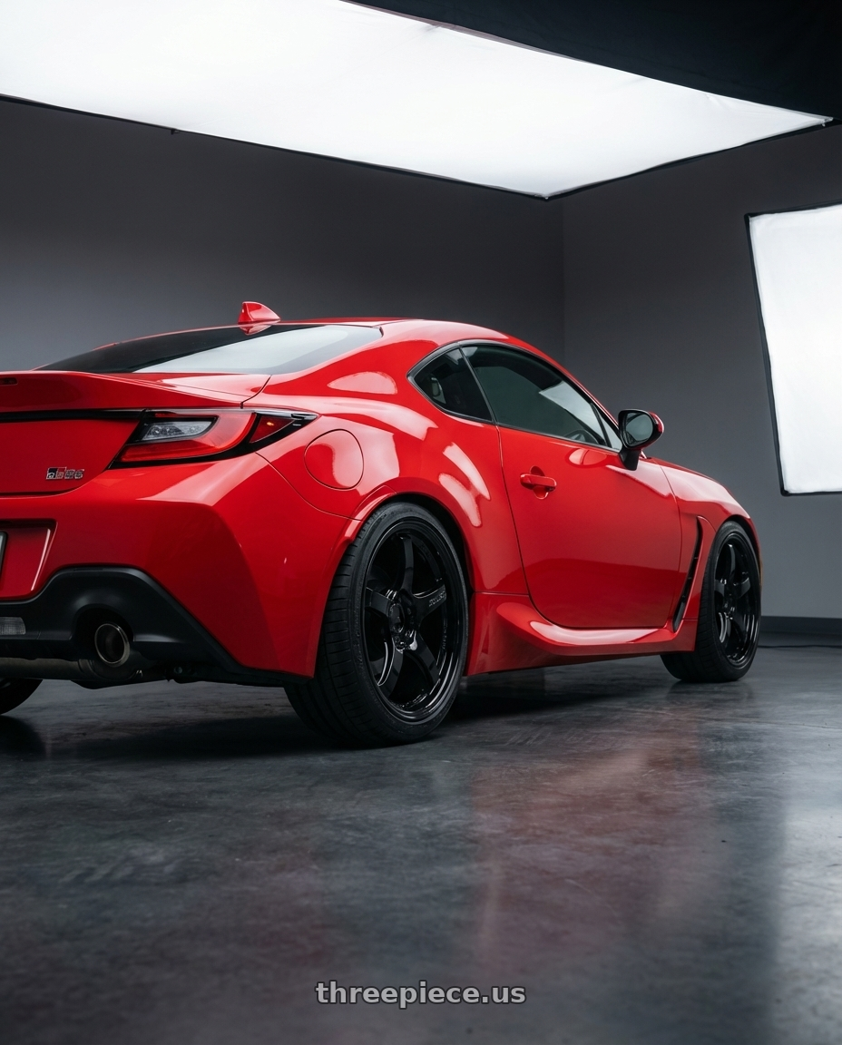 2024 Toyota GR86 with Gram Lights 57CR 5x114.3 18x8.5+50 Glossy Black wheels rear three quarter view square tires