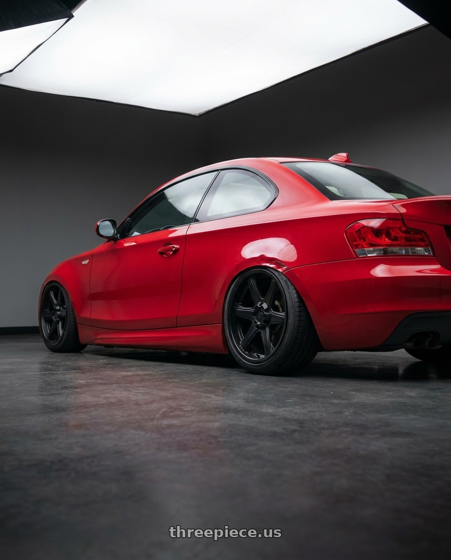 2011 bmw 128i with Enkei BHAWK 6x139.7 18x8.5+30 Black wheels rear three quarter view slight stretch tires
