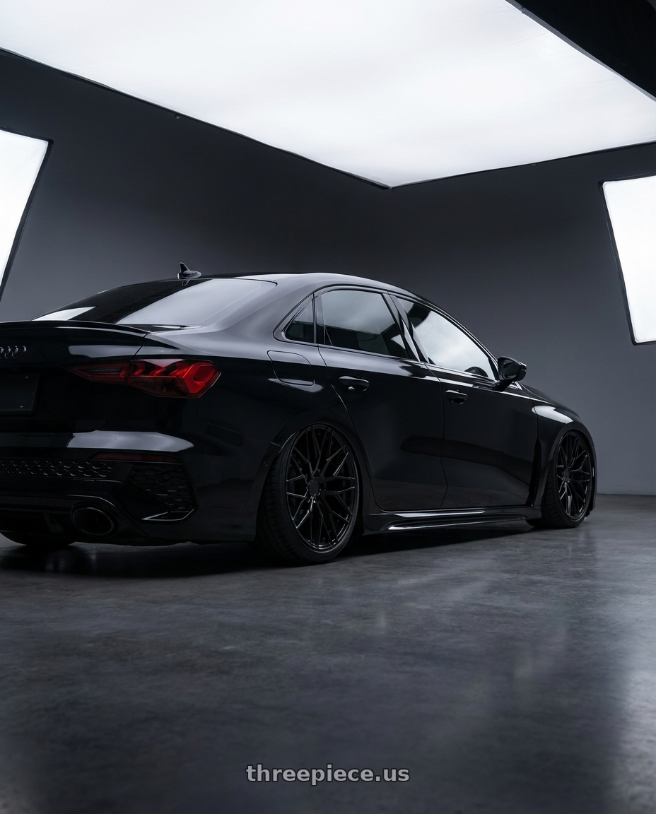 2022 Audi RS3 8Y with Avant Garde Wheels M520R 5X112 19x8.5 +35 Gloss Black wheels rear three quarter view slight stretch tires