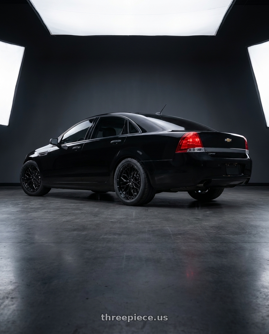 2014 Chevy caprice ppv with DOLCE PERFORMANCE MAGARI 5x120 20x9 +35 Gloss Black wheels rear three quarter view meaty tires