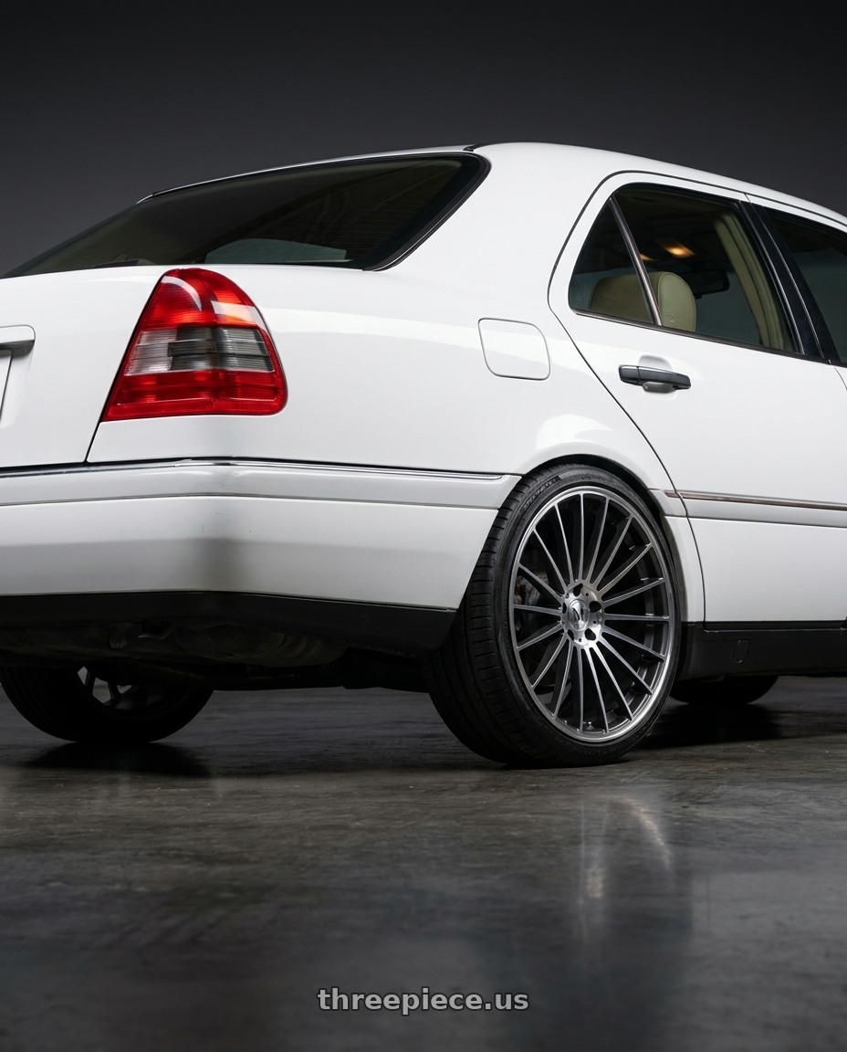 1995 mercedes c220 with Mandrus 23 5X112 17X8 +25 GUNMETAL W/ MIRROR CUT FACE wheels rear three quarter view square tires