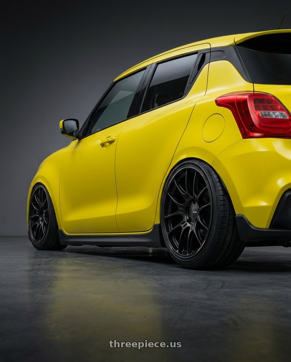 2019 Suzuki swift with Enkei GTC02 4x100 17x7.5+35 Black wheels rear three quarter view slight stretch tires