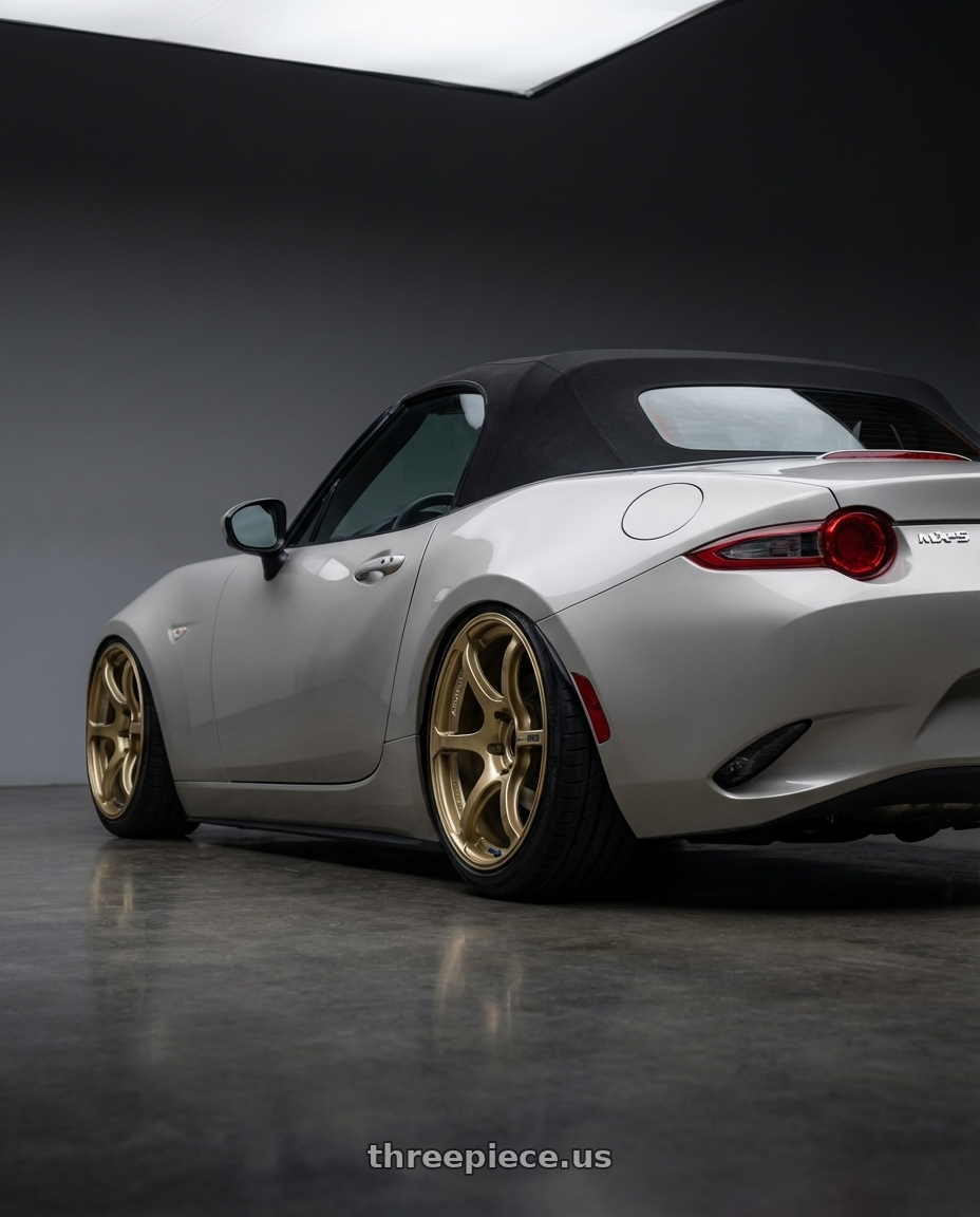 2021 Mazda MX-5 Miata ND with Advan RGIII 5x114.3 17x8.5+31 Gold wheels rear three quarter view slight stretch tires