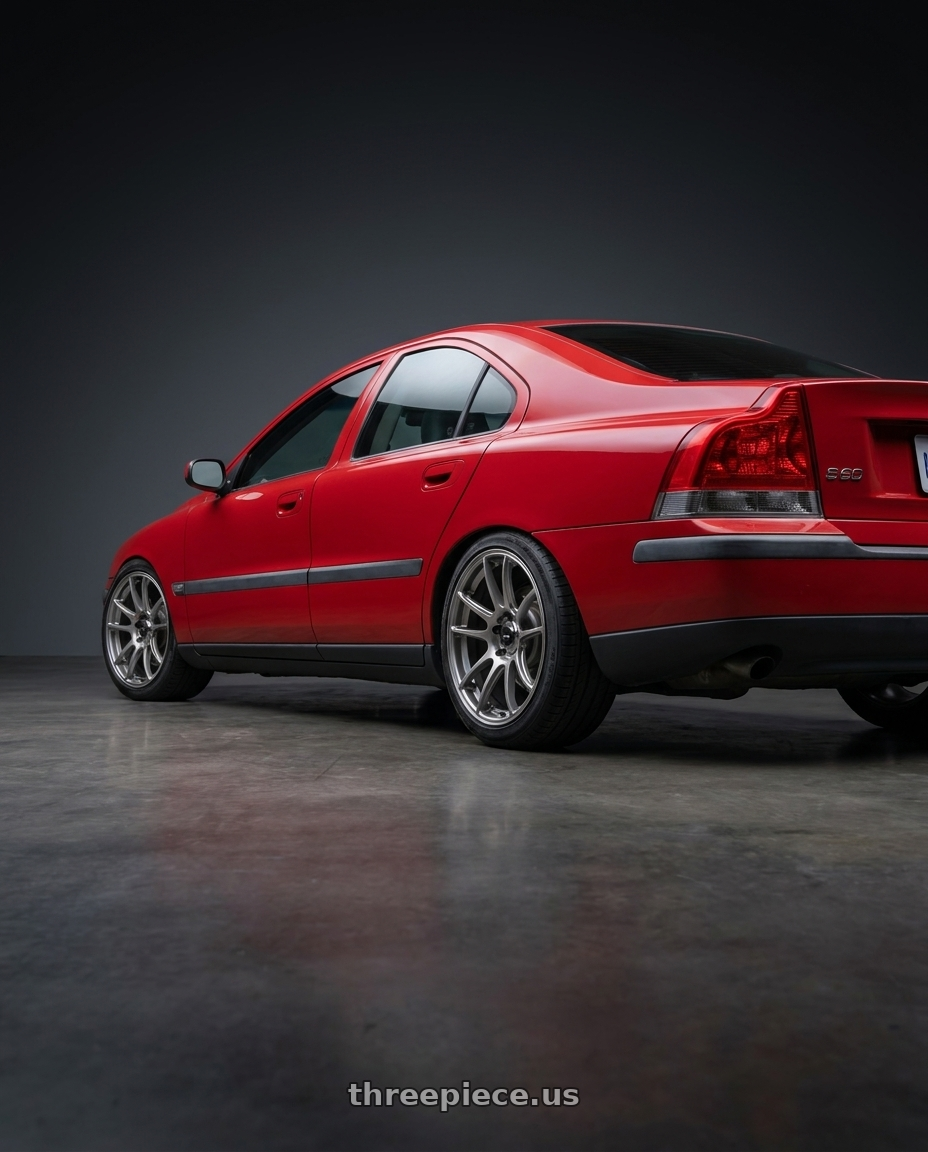 2002 Volvo s60 2.4t with Konig Heliogram 5X108 18x8.5+42 Titanium Metallic Knurled Bead Flow Formed wheels rear three quarter view slight stretch tires