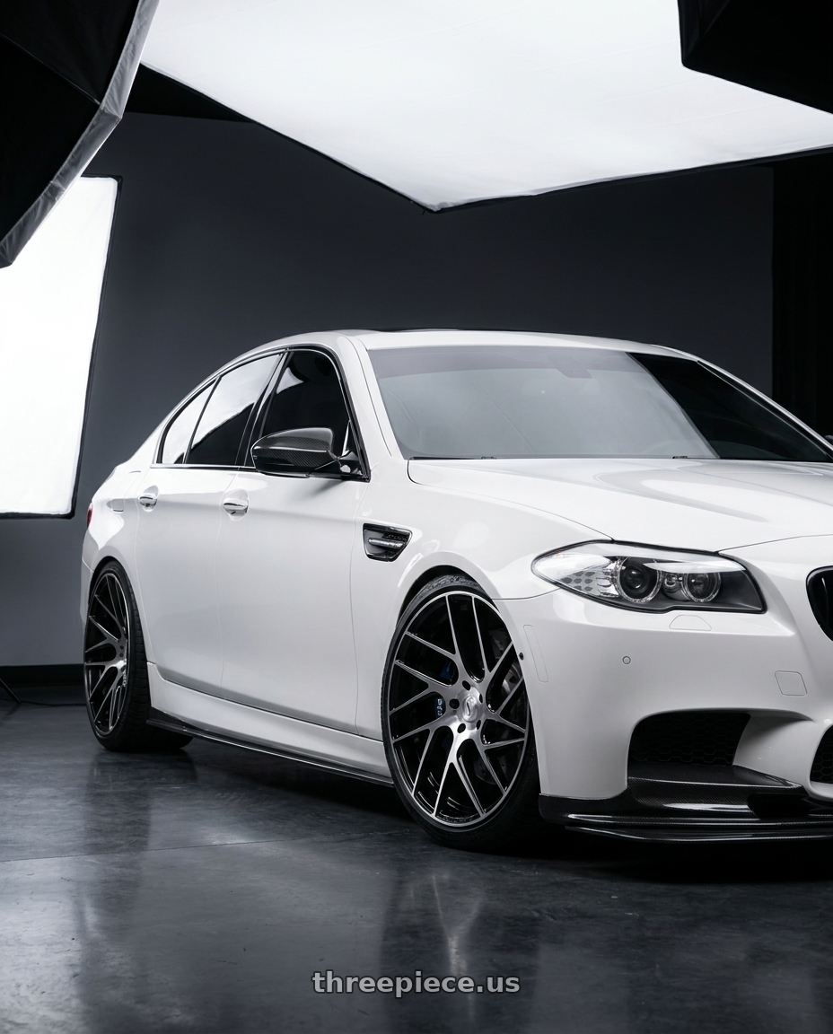 2012 BMW 550i with Status JUGGERNAUT 5X139.7 20X9 +20 GLOSS BLACK W/ MACHINED FACE wheels