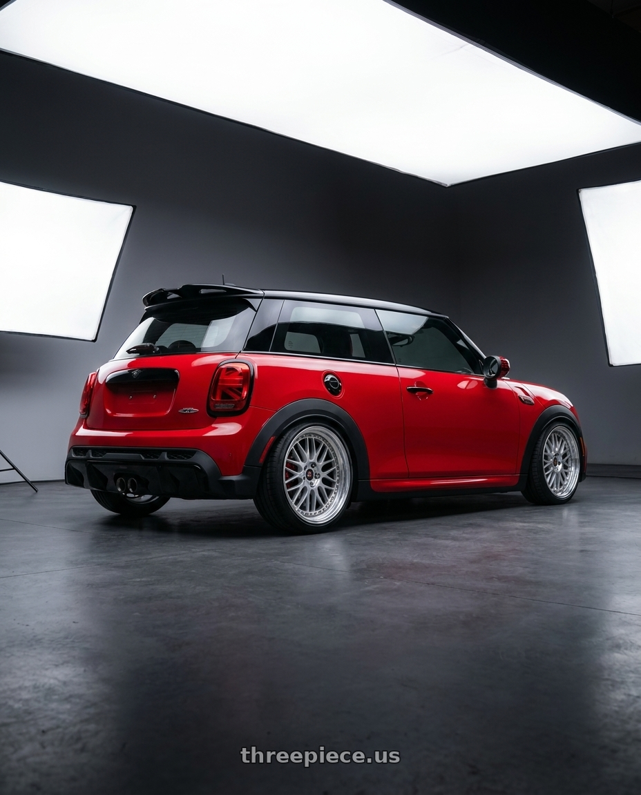 2025 mini jcw red with Work Vs-Xx 5x112 18x8.5+40 R Disk Light Grey Silver wheels rear three quarter view slight stretch tires