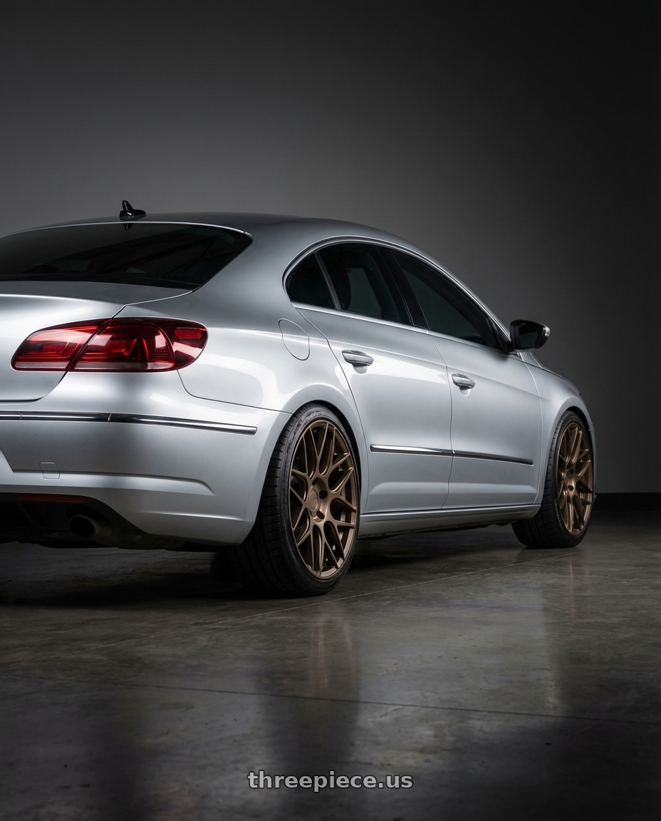 2015 Volkswagen CC with Aodhan AFF2 5x112 19x9.5+35 Matte Bronze wheels rear three quarter view square tires