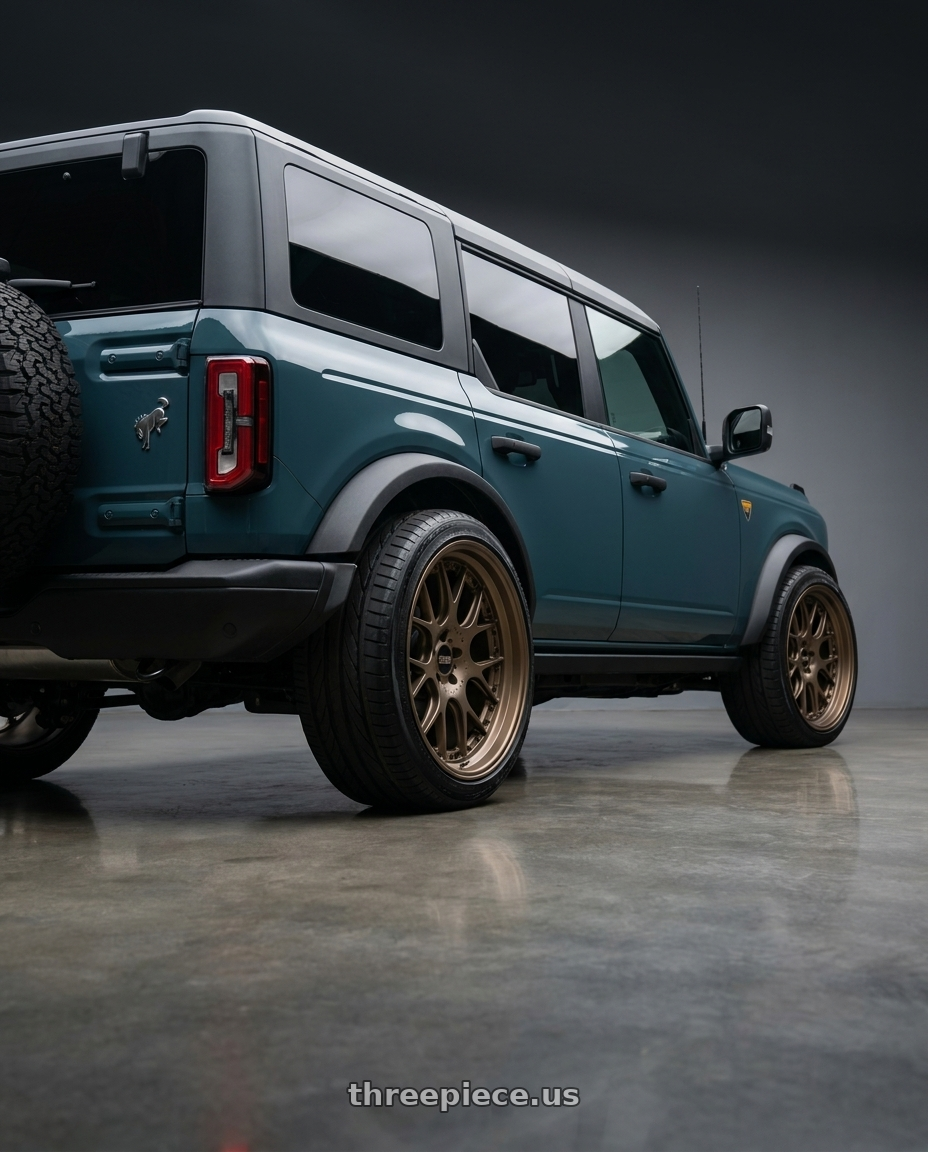 2025 Ford Bronco Wildtrak 2 with BBS CH-RII 5x112 22x10.5 +15 Matte Bronze wheels rear three quarter view extreme stretch tires