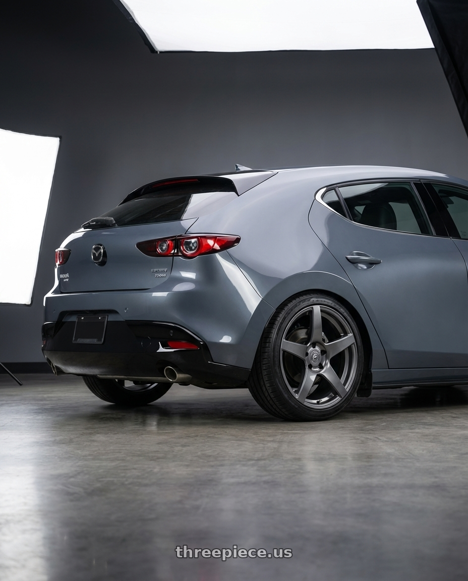2023 Mazda Mazda3 Turbo with Forgestar CF5 5x114.3 18x9 +35 Gloss Anthracite wheels rear three quarter view square tires