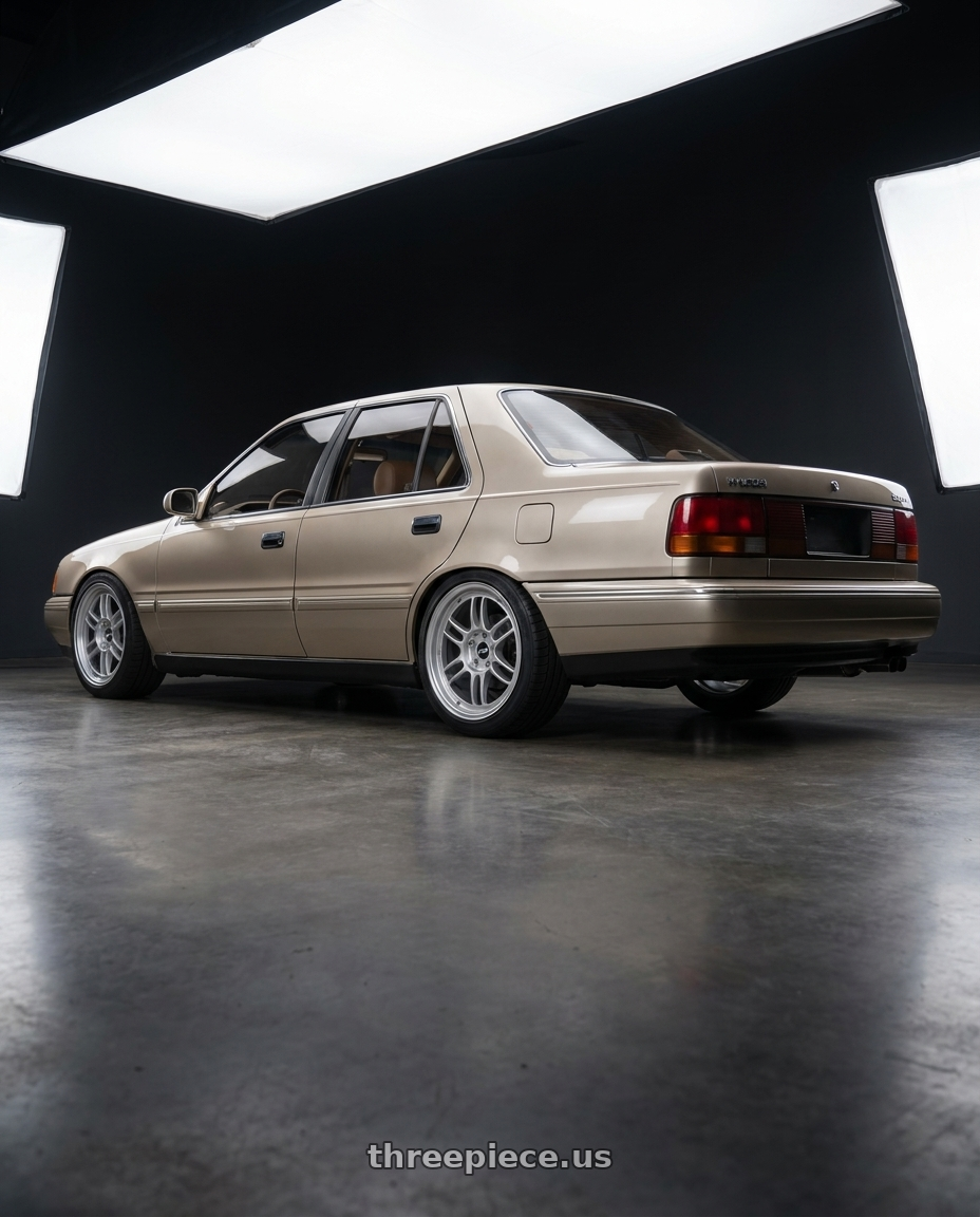 1990 Hyundai Sonata with Enkei RPF1 4x100 16x7+35 Silver wheels rear three quarter view square tires