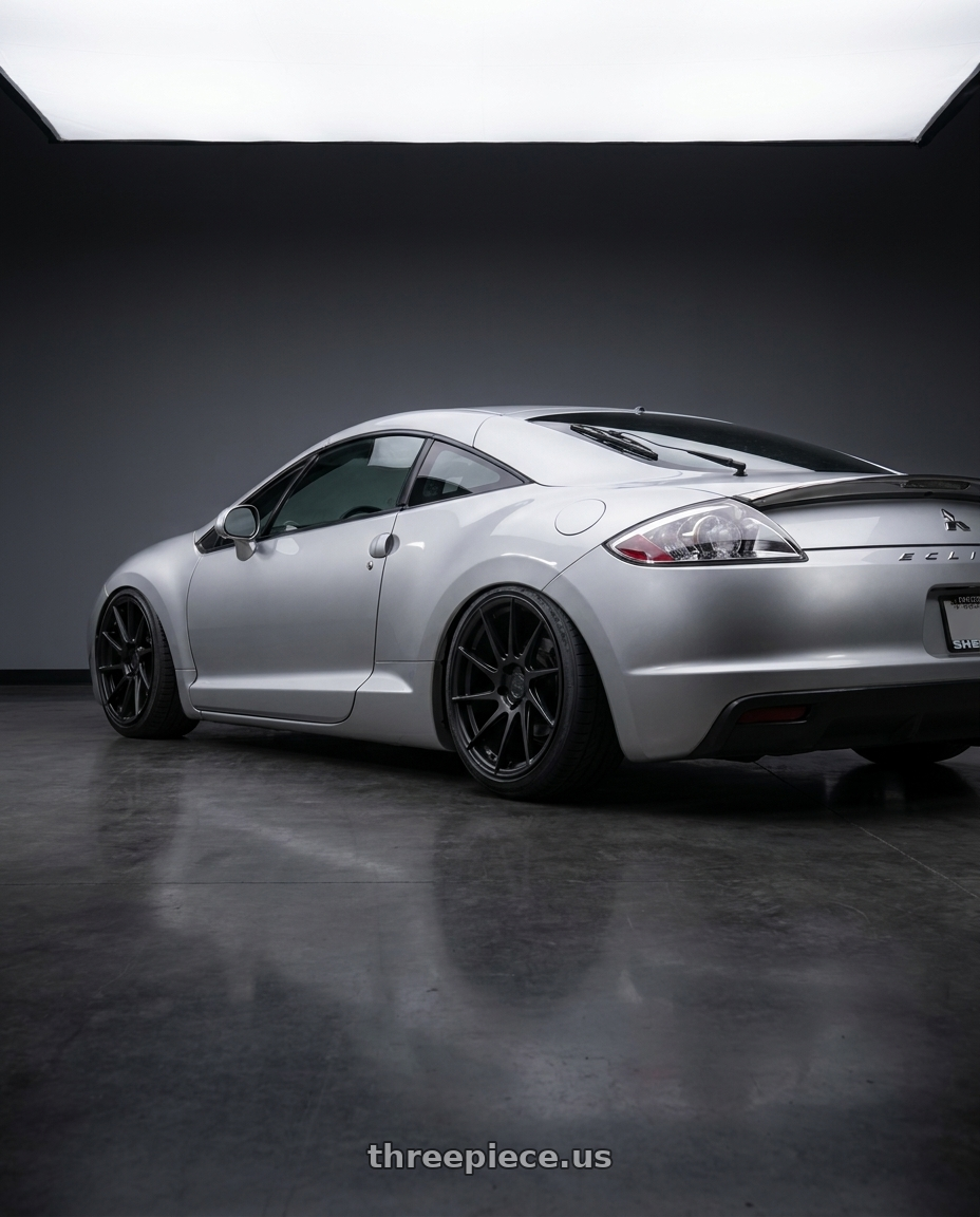 2010 Mitsubishi Eclipse with Aodhan AH09 5x114.3 18x8.5 +35 Matte Black wheels rear three quarter view slight stretch tires