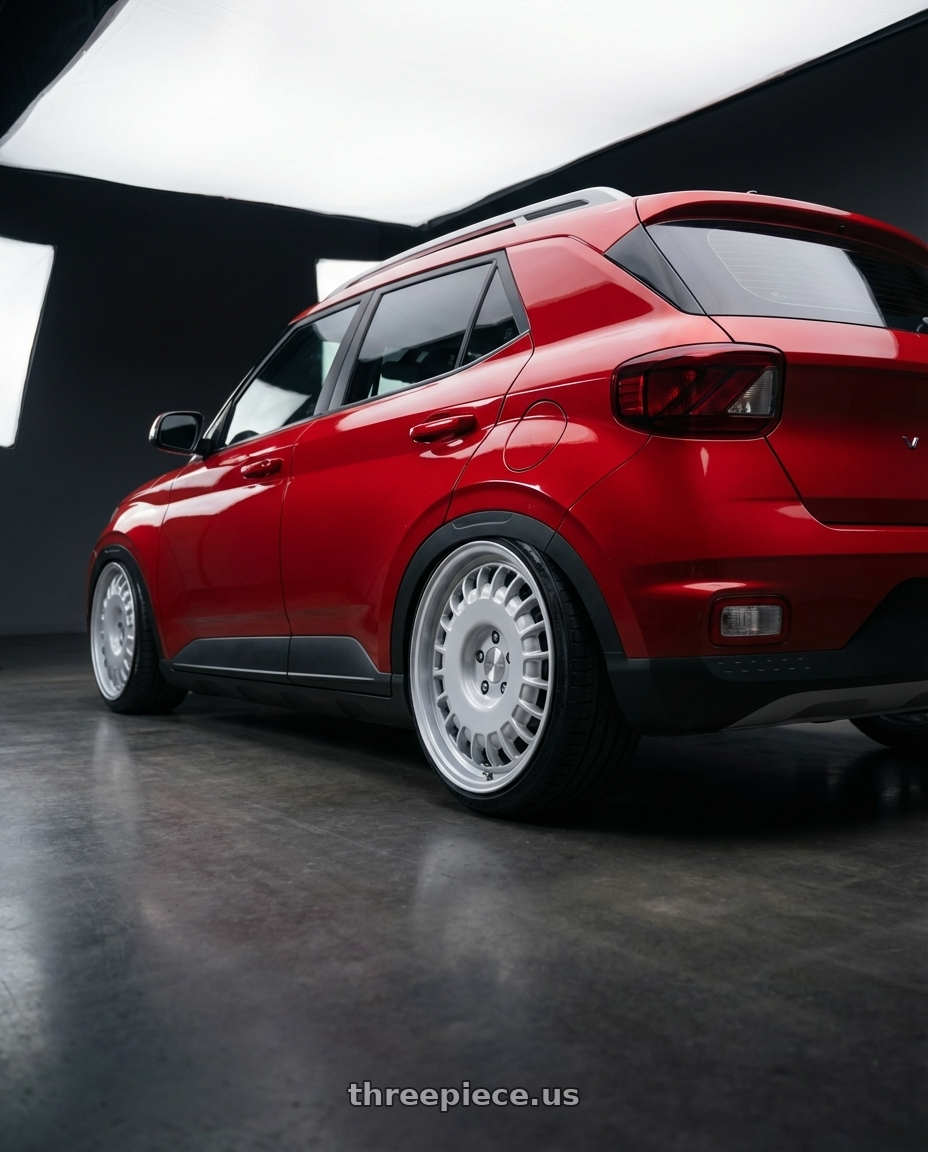 2021 Hyundai Venue with Rotiform RC205 PMF 5X108 19x8.5 +45 GLOSS SILVER wheels rear three quarter view slight stretch tires