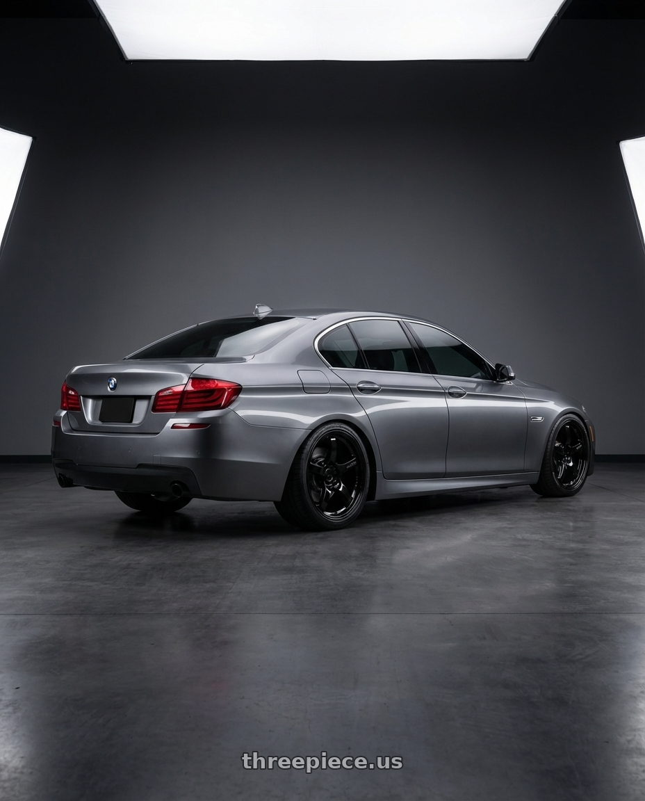 2016 BMW 5 Series F10 with Gram Lights 57CR 5x120 19x9.5+25 Glossy Black wheels rear three quarter view square tires