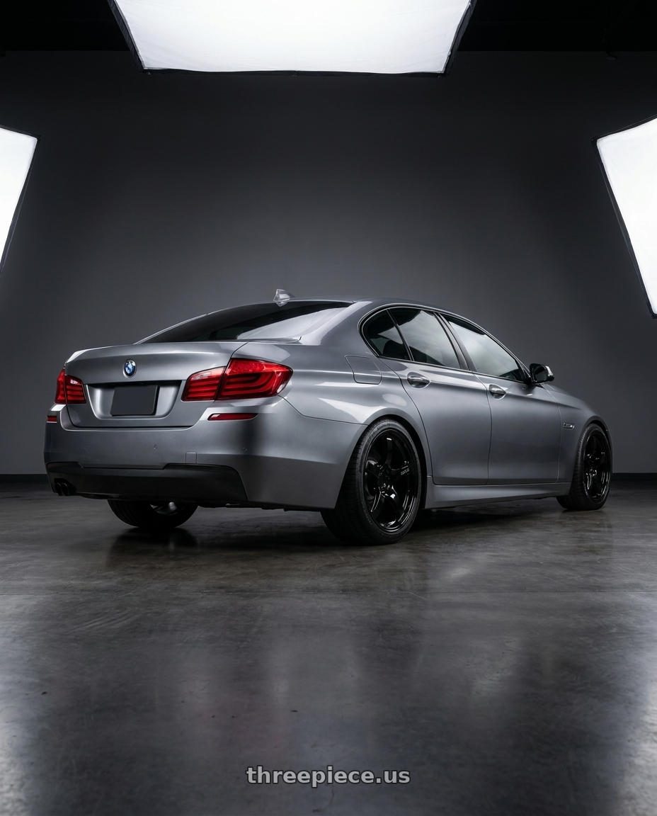 2016 BMW 5 Series F10 with Gram Lights 57CR 5x120 19x10.5+22 Glossy Black wheels rear three quarter view square tires