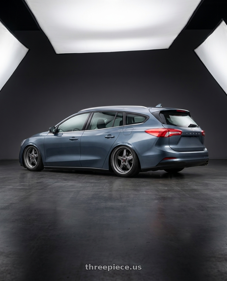 2025 Ford focuswagon with Race Star 91 Drag Star 4x108 15x10 +25 Grey wheels rear three quarter view slight stretch tires