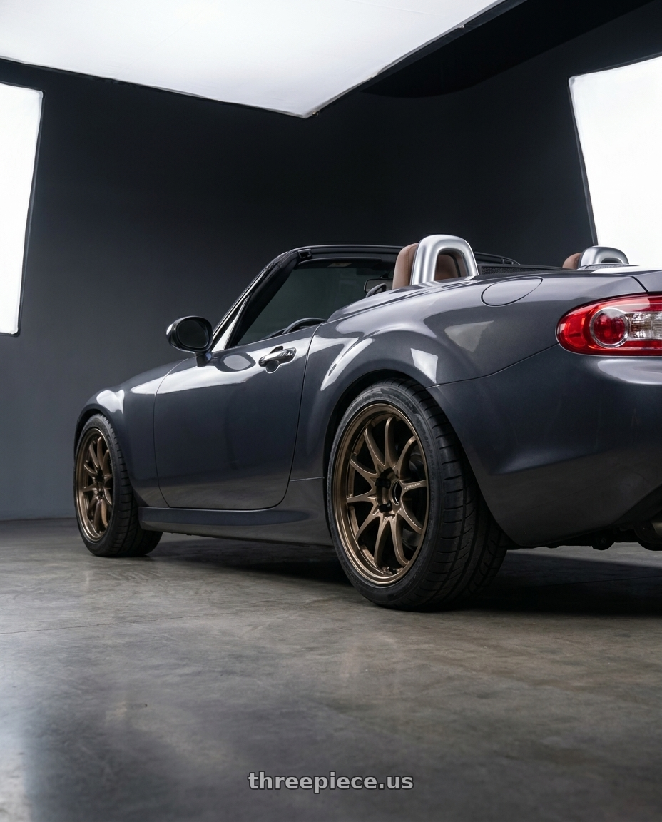 2014 Mazda Miata with Volk Racing CE28N-PLUS 5x114.3 17x7.5+38 Bronze wheels rear three quarter view square tires