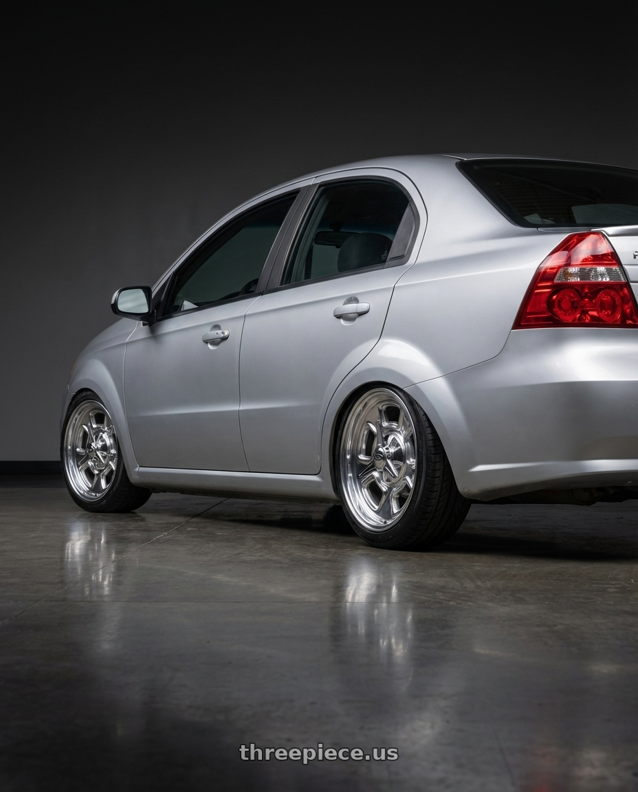 2011 Chevrolet aveo, lt, silver with BG Rod Works High Boy 5x114.3/5x120.65 15x8+0 Polished wheels rear three quarter view slight stretch tires