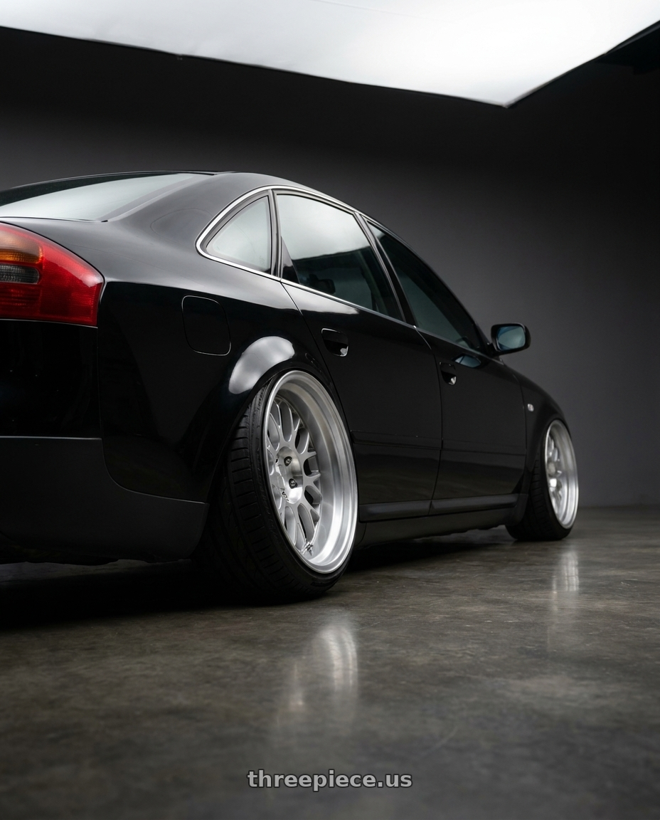 bagged 1999 audi a6 c5  with Rotiform RC204 PHX 5X112 19x10 +40 GLOSS SILVER W/ MACHINED FACE wheels rear three quarter view extreme stretch tires