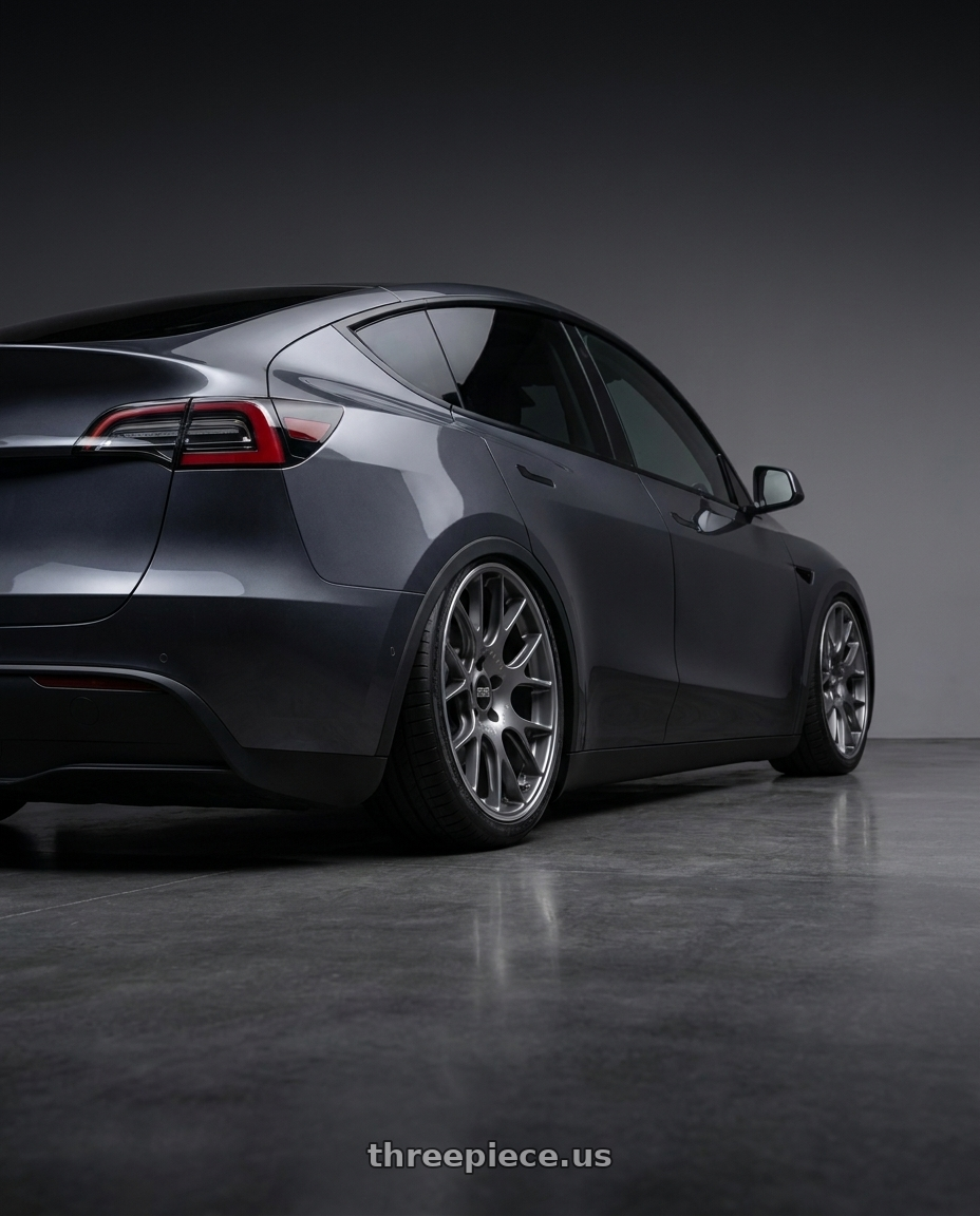 E.g. 2025 MODELY with BBS CH-R 5x114.3 20x8.5 +38 Satin Titanium Polished Rim Protector wheels rear three quarter view square tires