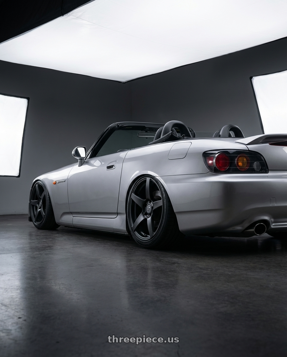 2009 Honda S2000 with Forgestar CF5 5x114.3 18x9 +35 Satin Black wheels rear three quarter view slight stretch tires