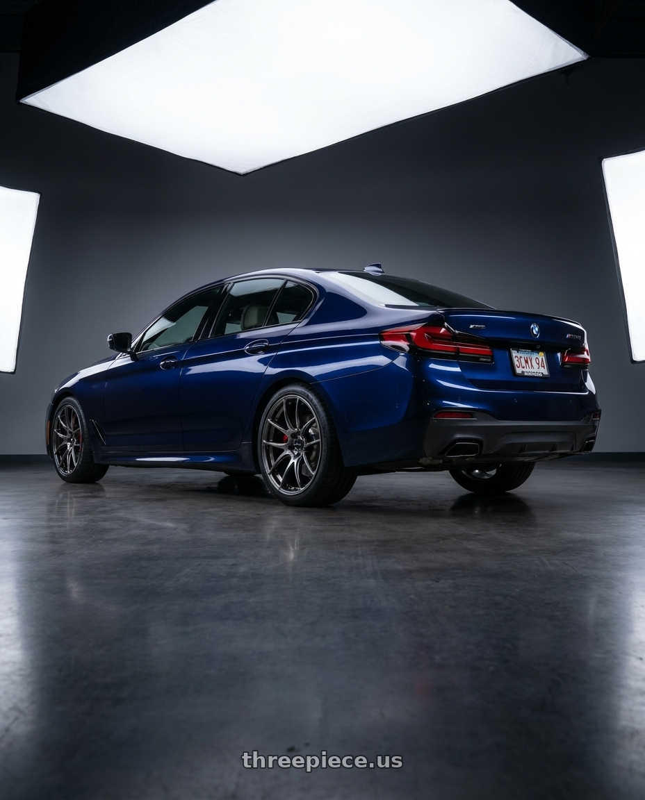 2023 bmw m550i xdrive tanzanite blue with Vors TR4 5x112 19x9.5  +22 Hyper Black wheels rear three quarter view square tires