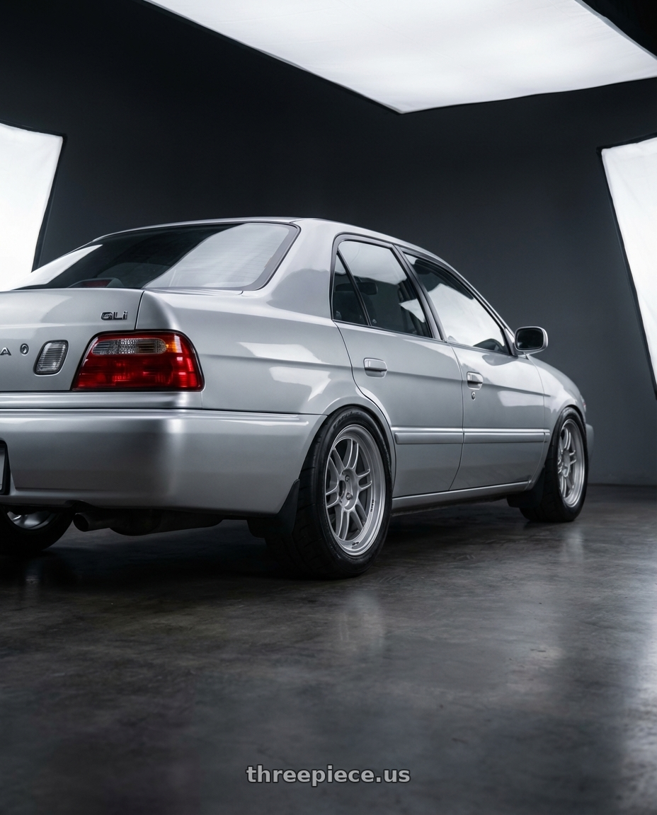 2000 Toyota soluna GLi, silver with Enkei RPF1 4x100 15x7+35 Silver wheels rear three quarter view meaty tires