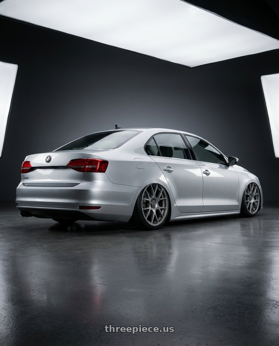 2016 Volkswagen Jetta GLI MK6 with fifteen52 APEX 5x112 / 5x120 18x8.5 +35 FROSTED GRAPHITE (SATIN GREY) wheels rear three quarter view slight stretch tires