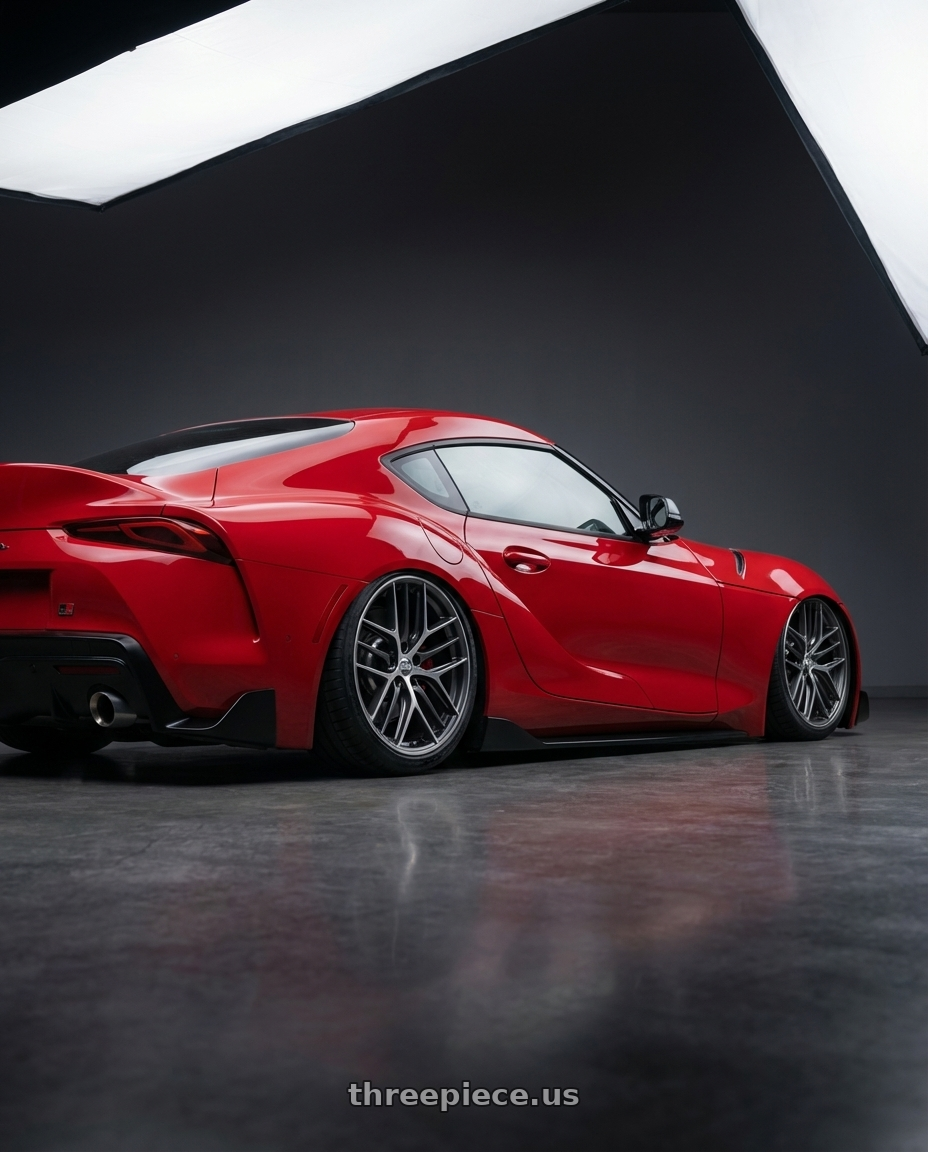 2023 Toyota GR Supra with BBS CC-R 5x112 19x10.0+48 Graphite w/ Diamond Cut Face wheels rear three quarter view slight stretch tires