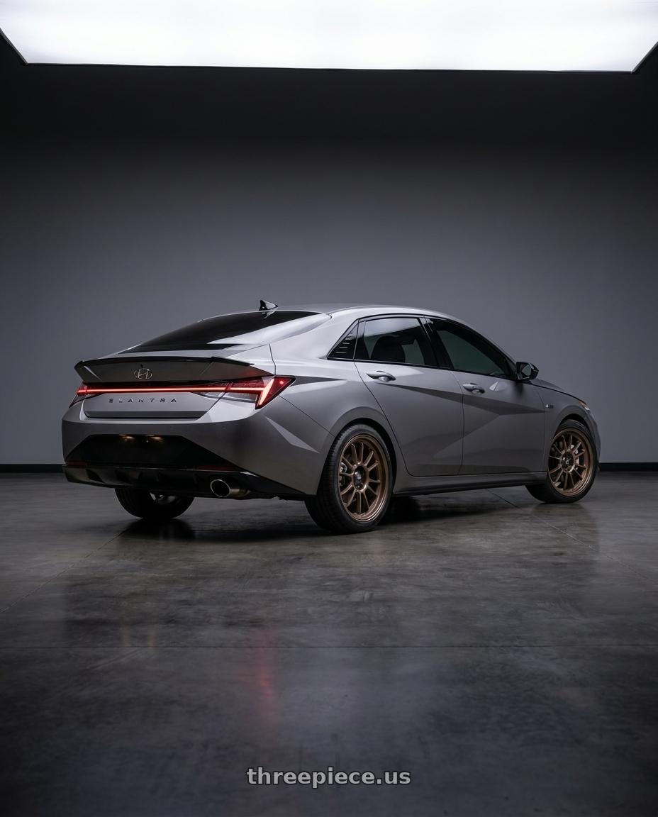 2023 Hyundai Elantra n line with Konig Hypergram 5x114.3 16x7.5+38 Race Bronze wheels rear three quarter view square tires
