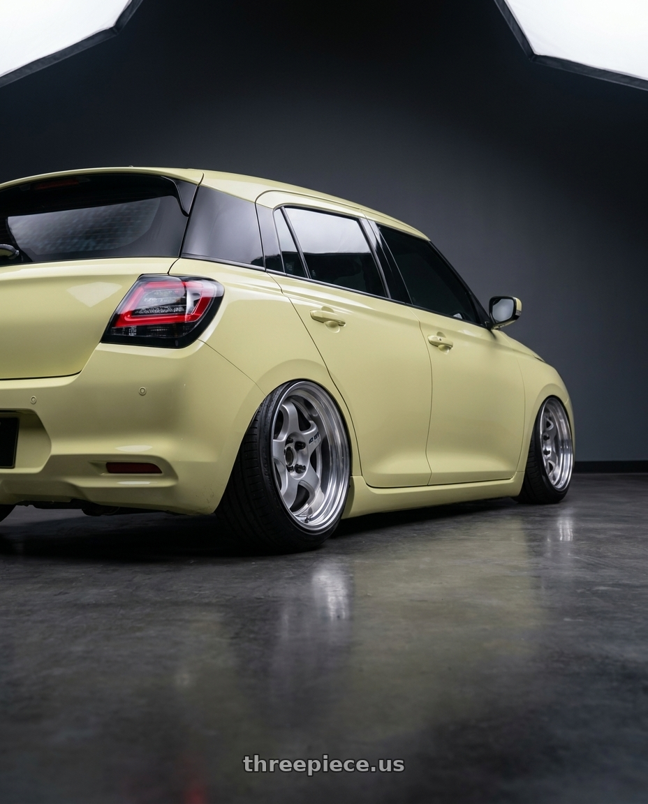 2026 Suzuki swift with Work Meister S1 2P 4x100 15x7+38 A Disk Silver wheels rear three quarter view square tires