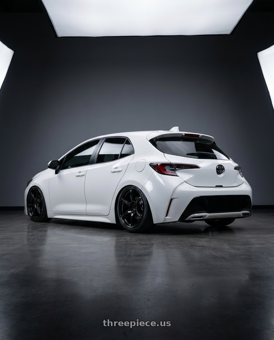 2023 Toyota Corolla Hatchback with Advan RGIII 5x114.3 18x10+35 Gloss Black wheels rear three quarter view slight stretch tires