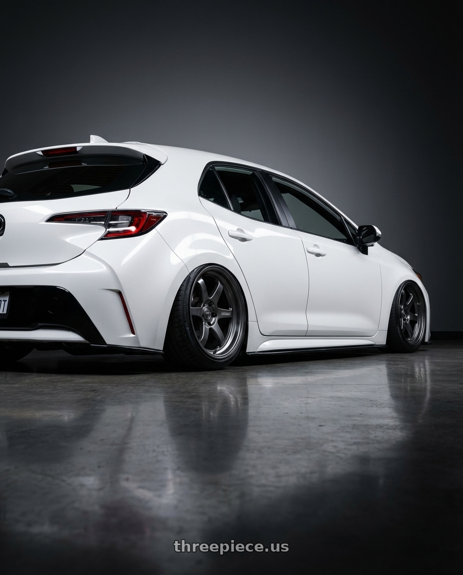 2023 Toyota Corolla Hatchback with Kansei K11G Tandem 5x114.3 18x10.5 12 Gunmetal wheels rear three quarter view slight stretch tires