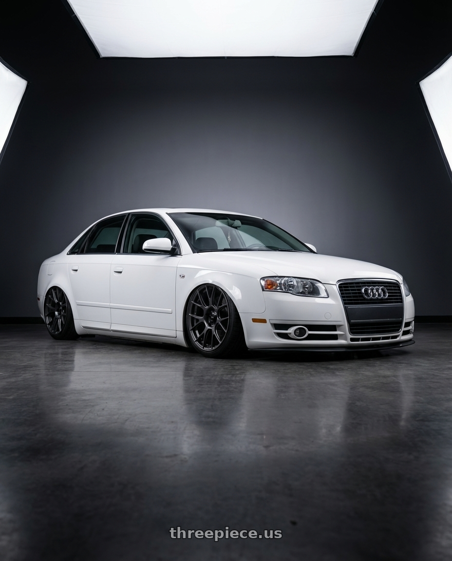 2010 Audi A4 B7 with Konig Ampliform 5x112 19x8.5+32 Dark Metallic Graphite wheels front three quarter view stanced stance
